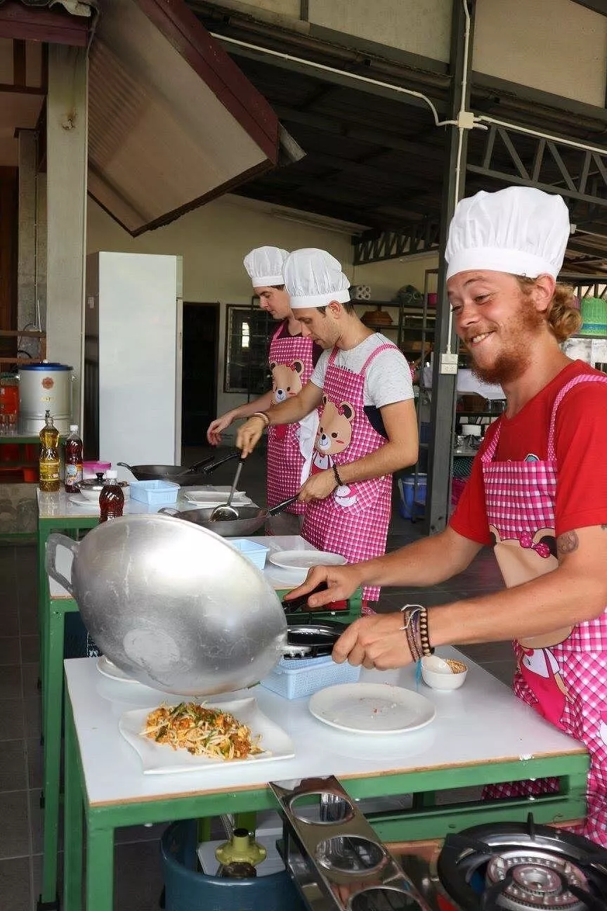 Happy man enjoying a Thai cooking class